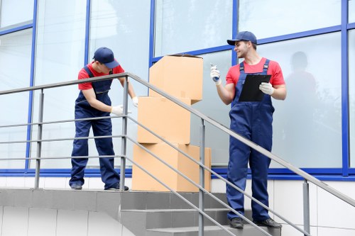 Man With A Van Blackheath team loading items safely with protective equipment