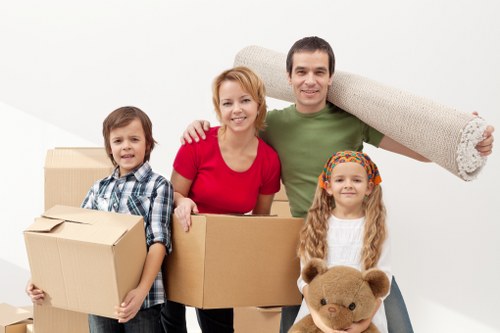 Moving team handling boxes and household items in Blackheath