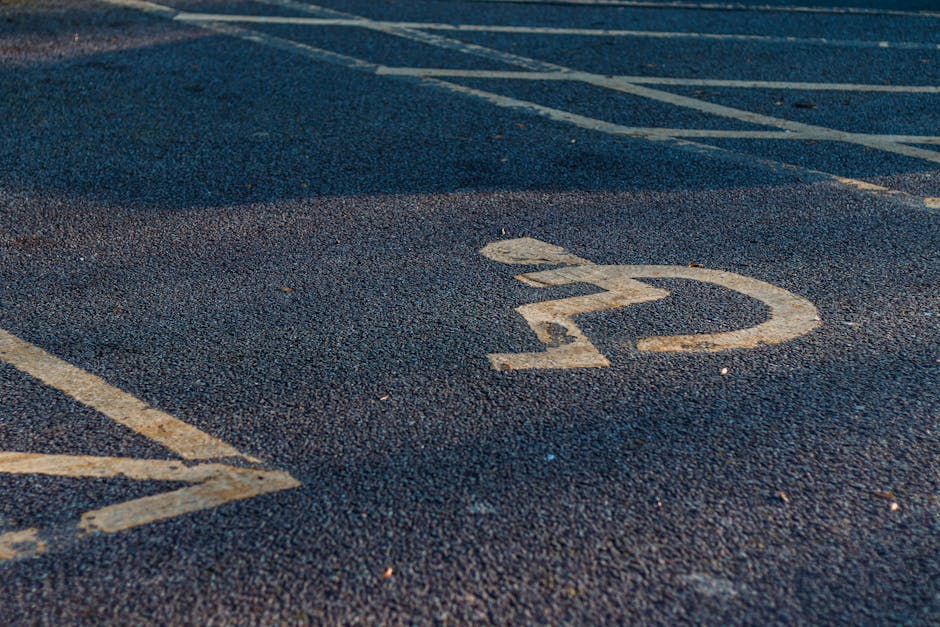 Close-up view of a numbered parking space on an asphalt surface, with a white painted number '22' visible in the centre of the image. Other parking lines and spaces are faintly visible surrounding the marked spot. The photograph was taken outdoors, likely near a residential property, during daylight hours. This image reflects the typical parking area used for house removals and furniture transport in a suburban setting, supporting efficient loading and unloading activities involved in home relocation services offered by Man With a Van Blackheath, as indicated on the webpage about parking, access, and van size considerations for Blackheath.